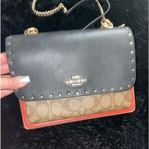 Brand new. Never used . Gorgeous Coach studded monogram multi color bag